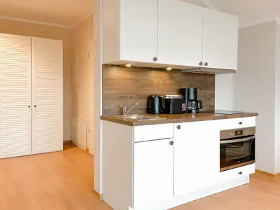 Küchenzeile im Wohnzimmer integriert