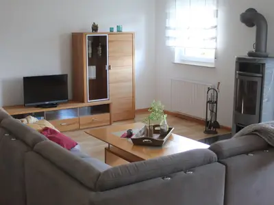 LandLeben-Wohnzimmer mit Kaminofen