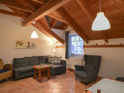 Gemütliches Wohnzimmer, perfekt zum Entspannen oder geselligen Beisammensein.