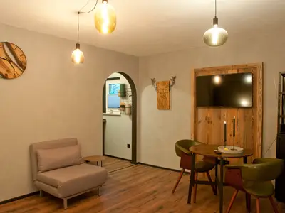 Wohn-  und Essbereich mit Schlafsessel