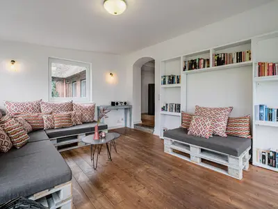 Wintergarten mit Meerblick, neben dem Wohnzimmer