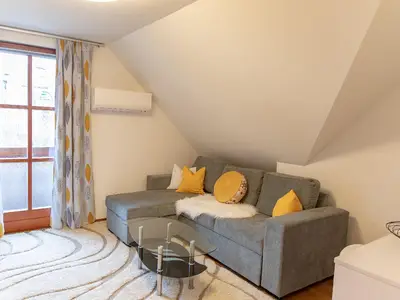 Wohnzimmer mit Schlafsofa Ferienwohnung Wiesenbunt (Foto by www.fotospass.at)