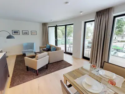 Luxussuite mit Sauna & Balkon – nur Minuten vom Strand