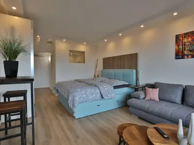 Strandkoje 6: Modernes Apartment mit Boxspringbett und Sitzecke – Wohlfühlurlaub in Timmendorfer Strand.