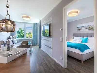 Wohn-Essbereich mit Zugang zum Schlafzimmer 1