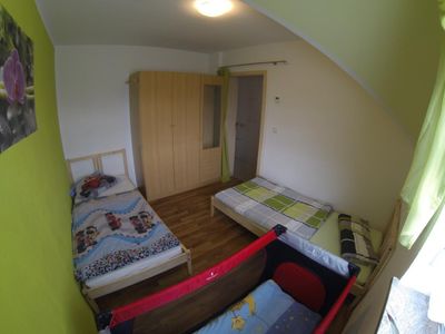 Schlafzimmer mit optionalen Kinderbett