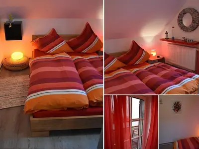 Zweites Schlafzimmer mit großem Einzelbett und direktem Balkonzugang