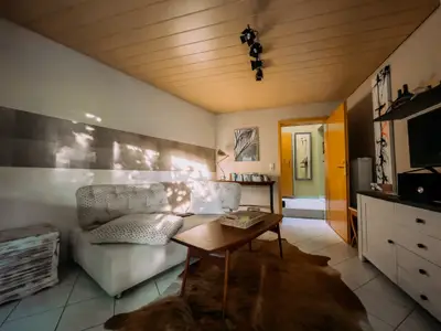 Wohnzimmer mit optionaler Schlafcouch