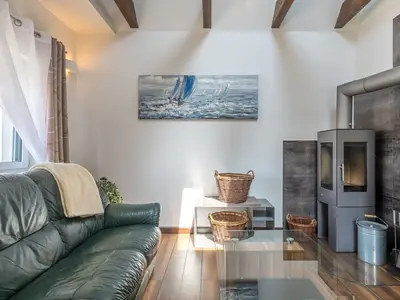Ferienwohnung Seeperle Wohnzimmer mit Ofen