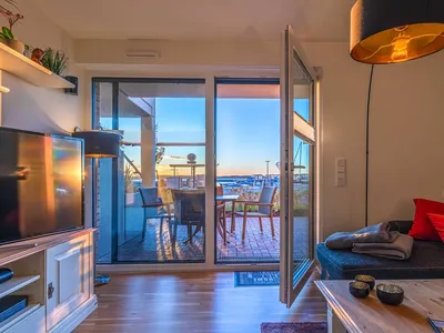 Ferienwohnung Fischotter: Blick auf Terrasse mit Hafenblick