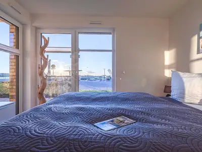 Ferienwohnung Fischotter: Schlafzimmer mit Wasserblick