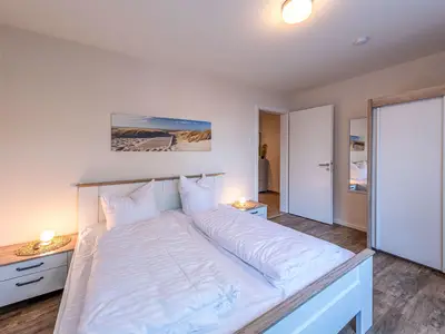 Ferienwohnung Müritz Charme Hafenresidenz: Schlafzimmer mit Doppelbett