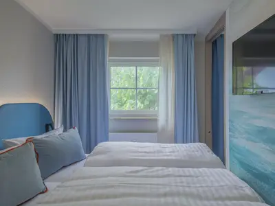 Ferienwohnung Hafendomicil MareMüritz Schlafzimmer mit TV