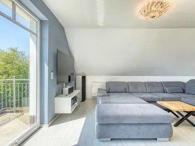Ferienwohnung SeeSuite Waren (Müritz) - Wohnraum mit Seeblick