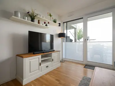 Ferienwohnung Fischotter Hafenresidenz Wohnzimmer mit Terrassenzugang