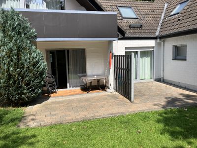 Terrasse mit Zugang zum Garten und Grillplatz