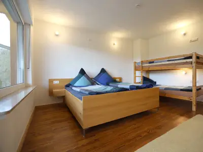 Wegwarte Ferienwohnung Schlafzimmer mit Doppel- und Etagenbett