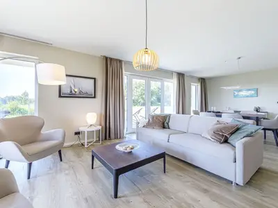 Ferienwohnung Strandidylle Ostseebad Wustrow Wohnzimmer mit gemütlichem Sofa