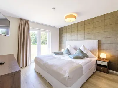 Ferienwohnung Strandidylle Ostseebad Wustrow Schlafzimmer mit großem Bett