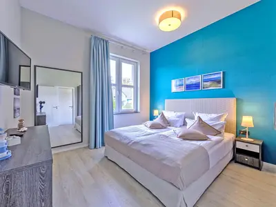 Ferienwohnung Lütt Matten Wustrow ZweiWasser Alte Seefahrtschule Schlafzimmer