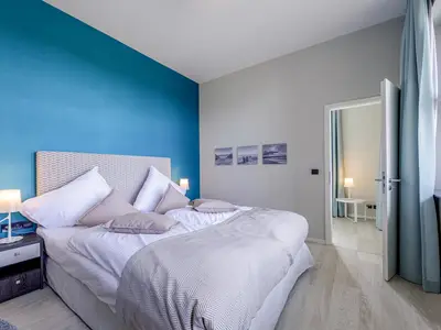 Ferienwohnung Panorama-Utkiek Seefahrtschule Wustrow Schlafzimmer mit Boxspringbett