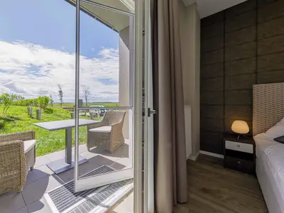 Ferienwohnung Gänseblümchen Wustrow Schlafzimmer mit Terrasse