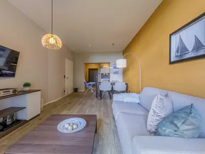 Ferienwohnung Gänseblümchen Wustrow Wohnzimmer mit Sofa