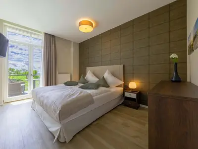 Ferienwohnung Gänseblümchen Wustrow  Schlafzimmer mit Doppelbett