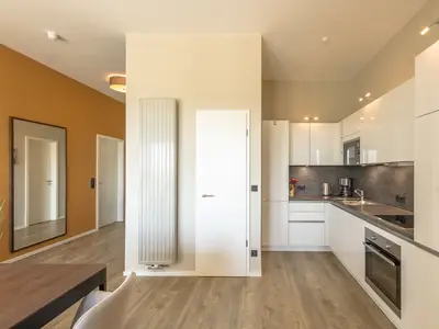Ferienwohnung Sonnengott in Wustrow Blick in die offene Küche