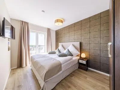 Ferienwohnung Boddenidylle Ostseebad Wustrow ZweiWasser Alte Seefahrtschule Schlafzimmer mit Doppelbett