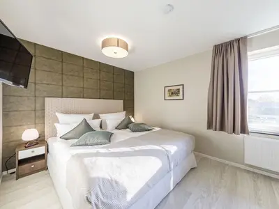 Ferienwohnung Boddendomizil Ostseebad Wustrow ZweiWasser Alte Seefahrtschule Schlafzimmer mit Doppelbett