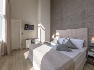 Ferienwohnung Mehr Meerblick Blick ins Schlafzimmer mit gemütlichem Doppelbett