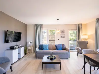 Ferienwohnung Seestern Wustrow offenes Wohnzimmer mit Terrassen Zugang