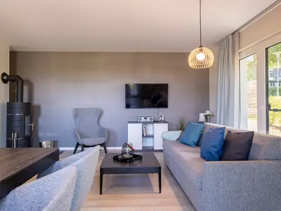 Ferienwohnung Seestern Wustrow offenes Wohnzimmer mit TV Wand