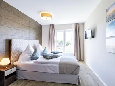 Ferienwohnung Boddendeck Ostseebad Wustrow ZweiWasser Alte Seefahrtschule Schlafzimmer mit Doppelbett