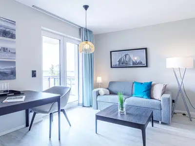 Ferienwohnung Kleine Strandmuschel Ostseebad Wustrow ZweiWasser Alte Seefahrtschule Heller Wohnbereich