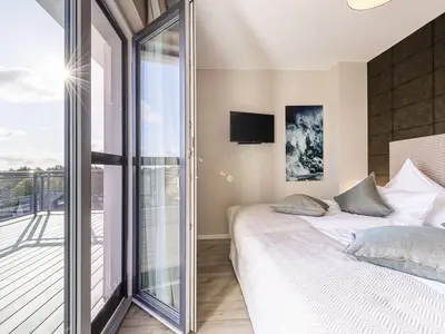 Ferienwohnung Sommerperle Ostseebad Wustrow ZweiWasser Alte Seefahrtschule Schlafzimmer mit Terrassenzugang