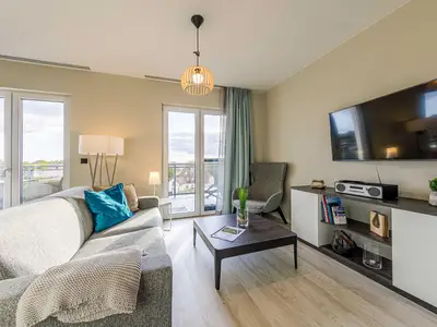 Ferienwohnung Sommerperle Ostseebad Wustrow ZweiWasser Alte Seefahrtschule Wohnzimmer mit Balkon