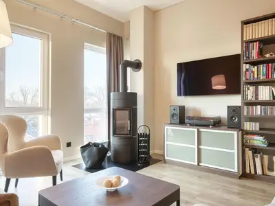 Ferienwohnung Kaptain´s Huus Ostseebad Wustrow ZweiWasser Alte Seefahrtschule Wohnzimmer mit Kamin