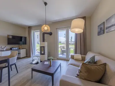 Ferienwohnung Großer Strandkorb Ostseebad Wustrow ZweiWasser Alte Seefahrtschule Gemütliches Wohnzimmer