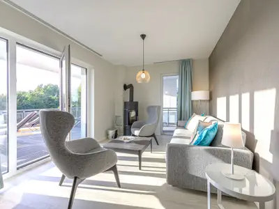 Ferienwohnung Strandblick Ostseebad Wustrow ZweiWasser Alte Seefahrtschule Wohnzimmer mit Kamin