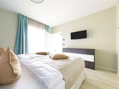 Ferienwohnung Lüttstuv Ostseebad Wustrow – ruhiges Schlafzimmer mit komfortablem Doppelbett