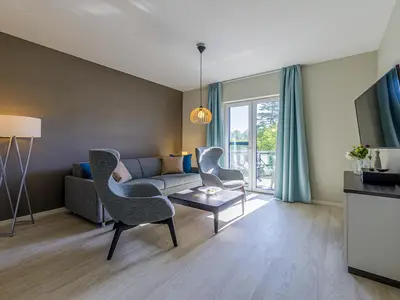 Ferienwohnung Wiesenkieker Ostseebad Wustrow - ZweiWasser Alte Seefahrtschule Wohnzimmer