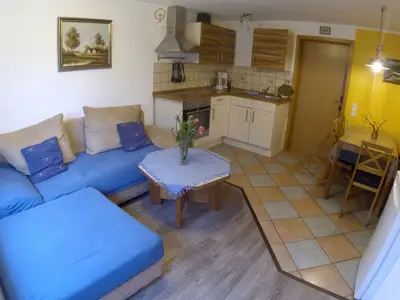 Wohnzimmer mit Küche Ferienwohnung Taubenhaus