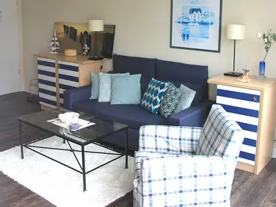 Wohnzimmer mit Schlafsofa