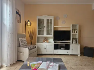 Wohnzimmer mit Terrasse und Aussenrollo