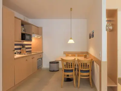 Ferienwohnung Leuchtturm offene Küche mit Essbereich