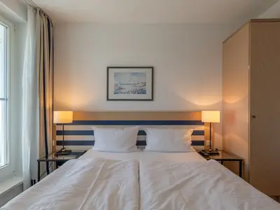 Ferienwohnung Sturmmöwe gemütliches Doppelbett im Schlafzimmer