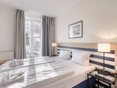 Ferienwohnung Krosse Krabbe gemütliches Doppelbett im Schlafzimmer