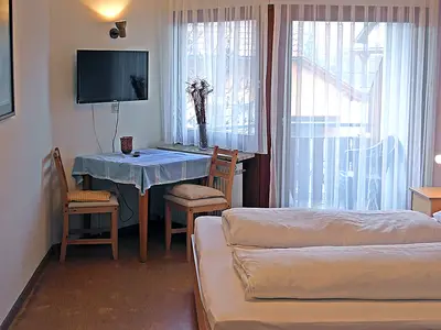 Dreibettzimmer mit Balkon